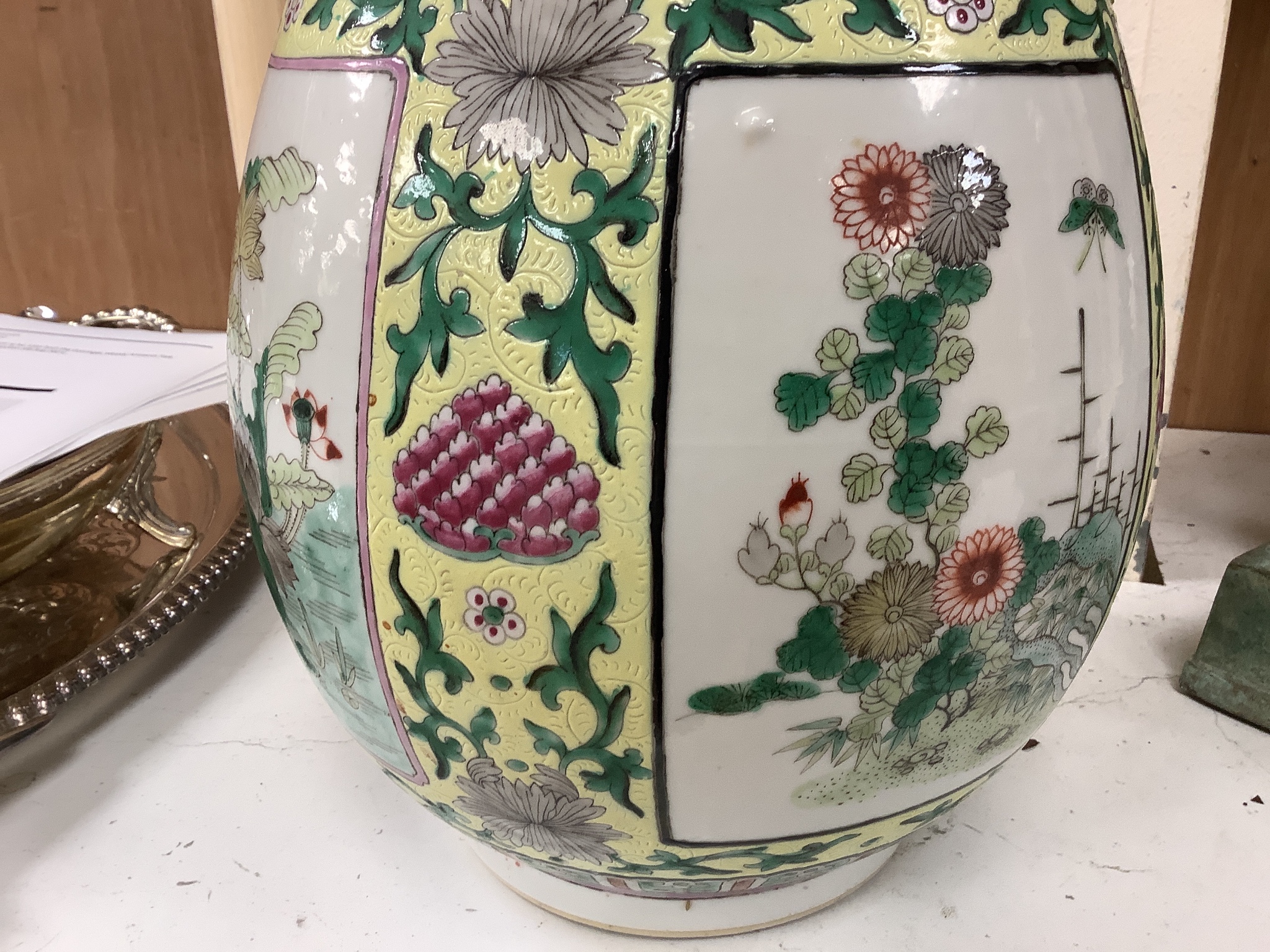 A large 19th century Chinese famille verte yellow ground bottle vase, height 47cm, restorations